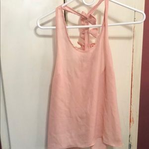 Pink translucent top with bows on back